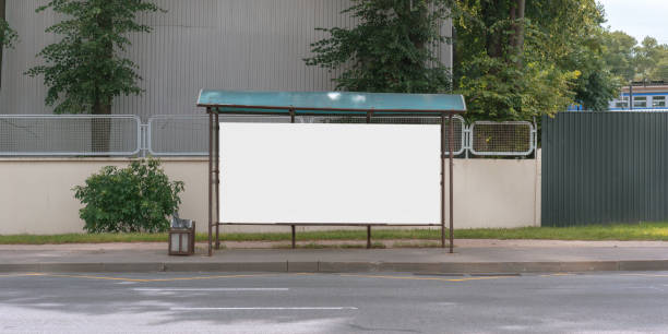 empty bus stop with blank white billboard for commercial information advertising concept - bus stop imagens e fotografias de stock