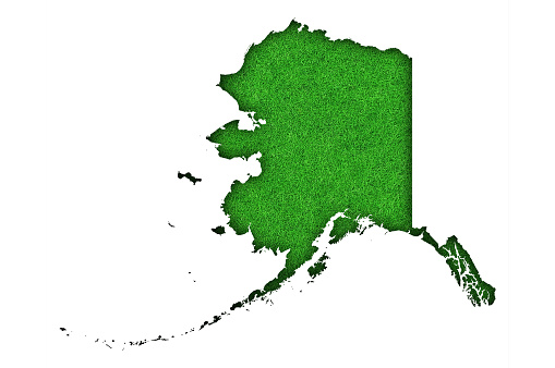 Map of Alaska on green felt