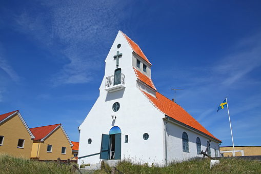 Swedish Seamen's Church, traditional white building with orange roof, located in Skagen, Denmark.