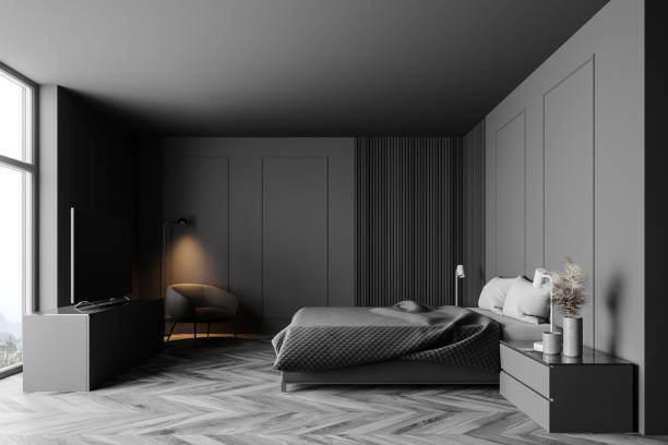 istock Grey and wooden bedroom with TV, side view 1257007548