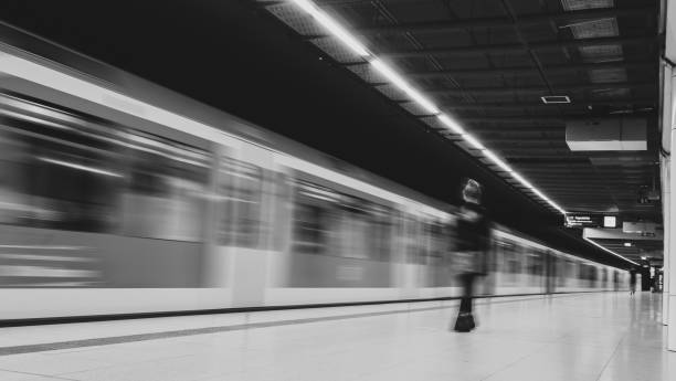istock Running train in train station at the night time with speed for background usage 1257007779