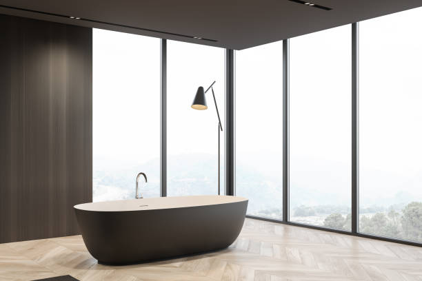 istock Panoramic dark wooden bathroom corner with tub 1257009956