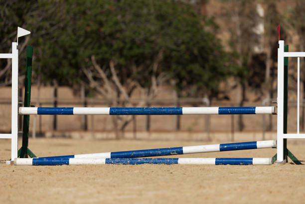 Wooden barriers for jumping horses, empty field for horse jumping event competition