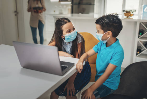 istock Mother Helping To Her child To Finish School Homework During Coronavirus Quarantine 1257013556