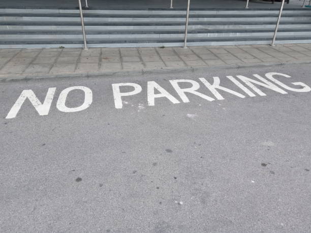 istock No Parking Painted Road Sign 1257014579