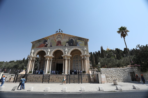 Jerusalem, Israel - 09 21 2017: Tourists and pilgrims are visiting Church of All Nations in Jerusalem Old City. The Jerusalem Old City is home to several sites of key religious importance.