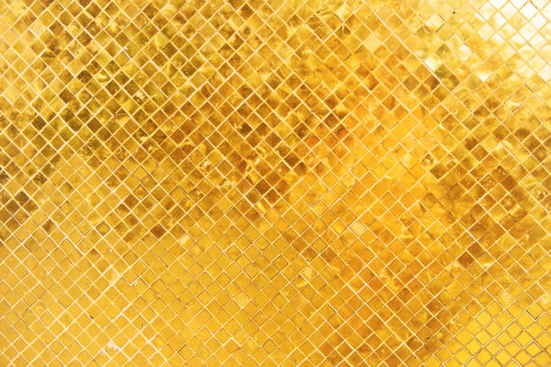 istock Closeup view of many gold shiny squares surface 1257018974