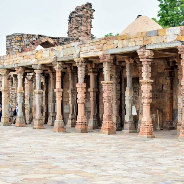 istock Inside the Qutub Minar Complex with antic ruins and inner square. UNESCO World Heritage in Mehrauli, Old Architecture inside Qutub Minar during the day time in Delhi India, Qutub Minar inside old architecture 1257019706