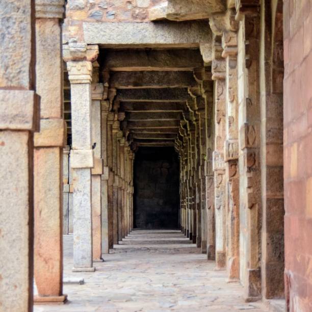 istock Inside the Qutub Minar Complex with antic ruins and inner square. UNESCO World Heritage in Mehrauli, Old Architecture inside Qutub Minar during the day time in Delhi India, Qutub Minar inside old architecture 1257019755