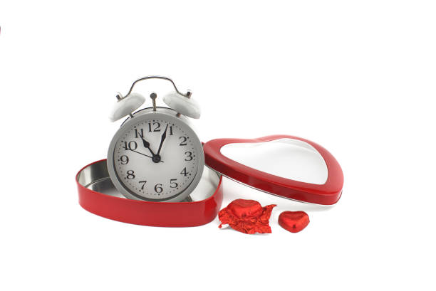 istock Retro alarm clock in a red heart shaped box 1257023892