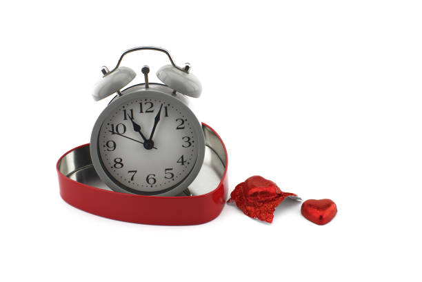 istock Retro alarm clock in a red heart shaped box 1257023894