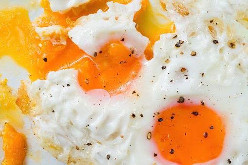 Runny Fried Eggs Stock Photo - Download Image Now - Egg Yolk, Egg