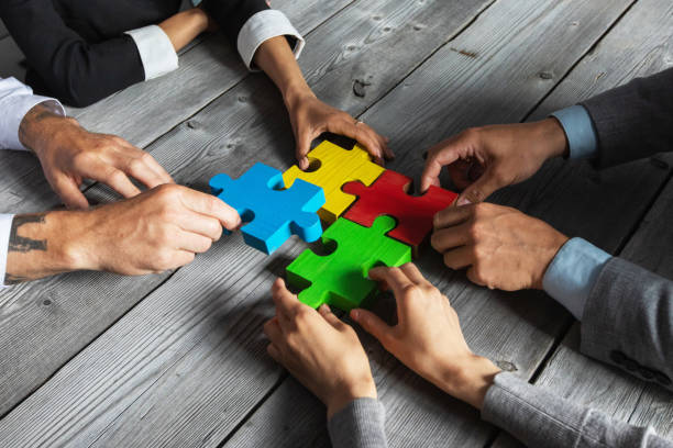 istock Business people and puzzle pieces 1257025878