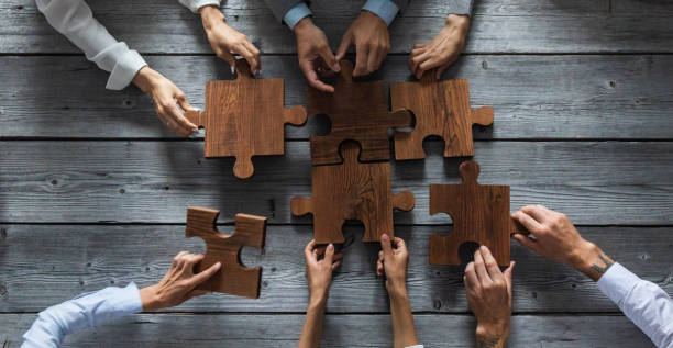 istock Business people and puzzle pieces 1257026467