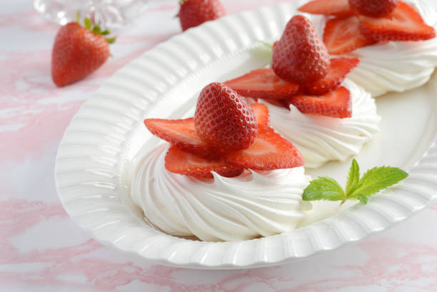 istock strawberry meringue nests with mint on a platter 1257026555