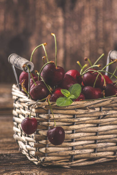 istock Black cherry in the basket. Copy Space 1257026656