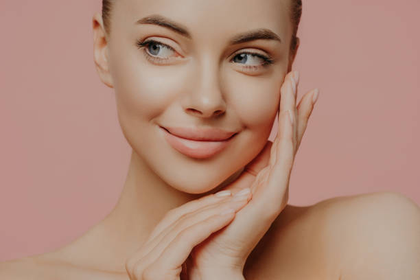 Beautiful young woman with clean fresh skin look away. Girl beauty face care. Facial treatment. Cosmetology, beauty and spa . Beautiful young woman with clean fresh skin look away. Girl beauty face care. Facial treatment. Cosmetology, beauty and spa . beauty stock pictures, royalty-free photos & images