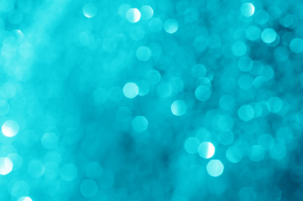 istock glitter light sparkle blue gorgeous bokeh defocused abstract background shiny. 1257031746