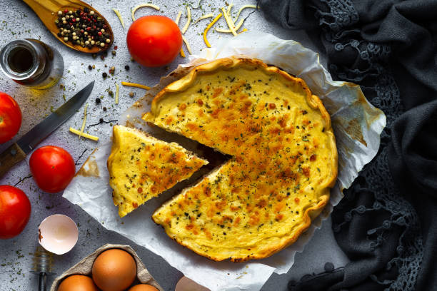 Vegetable quiche, tomato, eggs and cheese stock photo