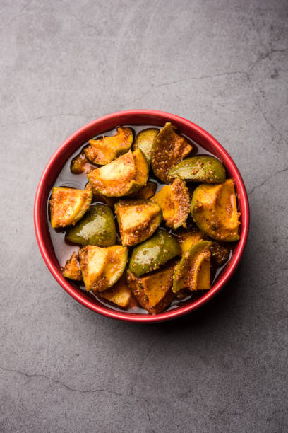 Indian Homemade Raw Mango Pickle or aam ka achar or Kairi Loncha in a bowl