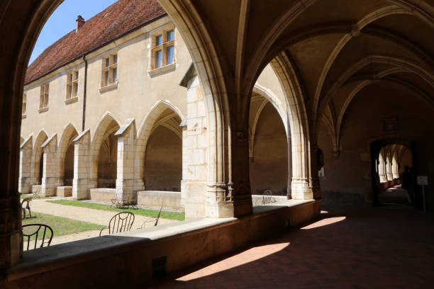 First cloister, says Hosts. The royal monastery of Brou. Bourg-en-Bresse. Ain. Auvergne-Rhône-Alpes. France. Europe. Europe. France. Auvergne-Rhône-Alpes. Ain. Bourg-en-Bresse. 08/05/2019. This colorful image depicts first cloister, says Hosts. The royal monastery of Brou. ain france photos stock pictures, royalty-free photos & images
