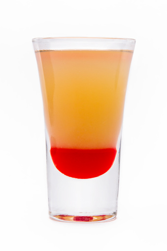 Shot of different alcoholic drinks on a white background