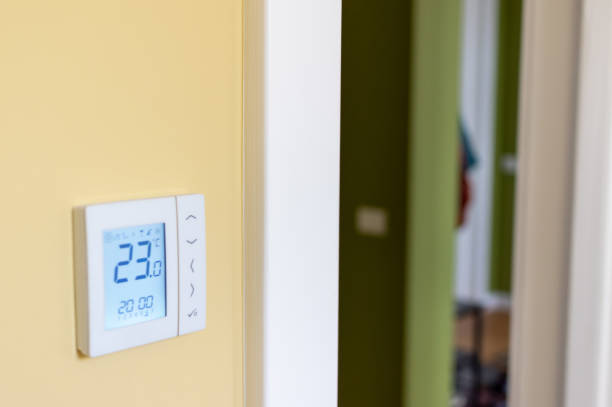istock Electronic thermostat at home 1257039318