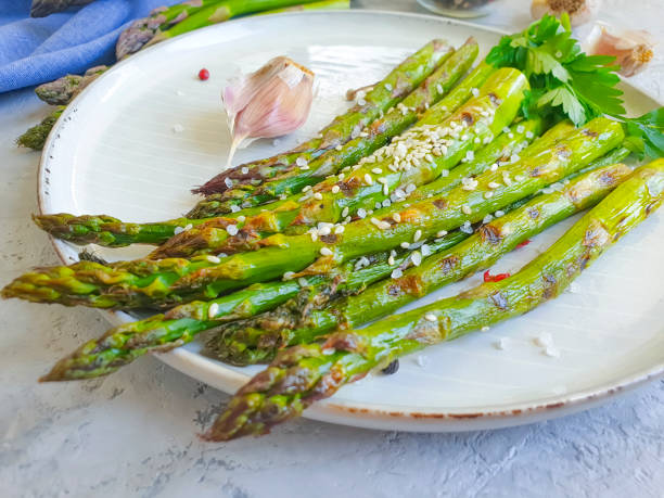 istock fried asparagus on a concrete background 1257039374