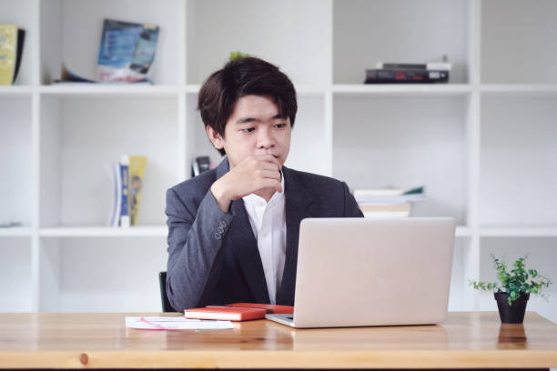istock Financial analyst with business research data  information on laptop computer screen in work office. 1257042220