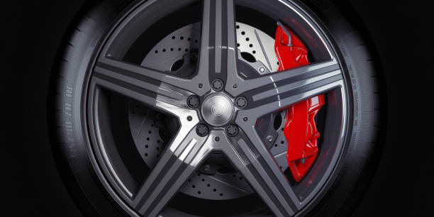 istock Car wheel with red breaks on black background. 1257043583