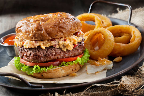 istock Pimento Cheese Burger with Lettuce, Tomato and Thick Cut Onion Rings 1257044271