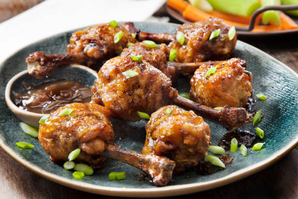 istock Honey Garlic Lollipop Chicken Wings with Carrots, Celery and Ranch Dip 1257044331
