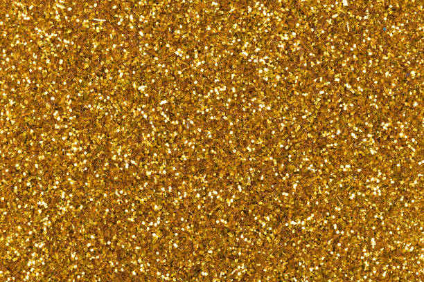 istock Elegant gold glitter texture, new background with attractive shiny surface for design. 1257044439
