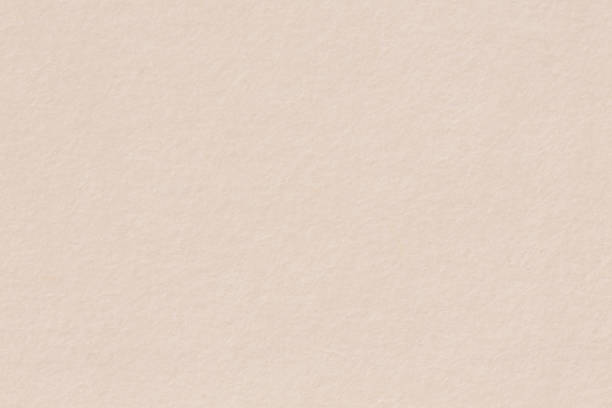 istock Paper texture light rough textured spotted blank copy space background in beige, yellow, brown. 1257044643