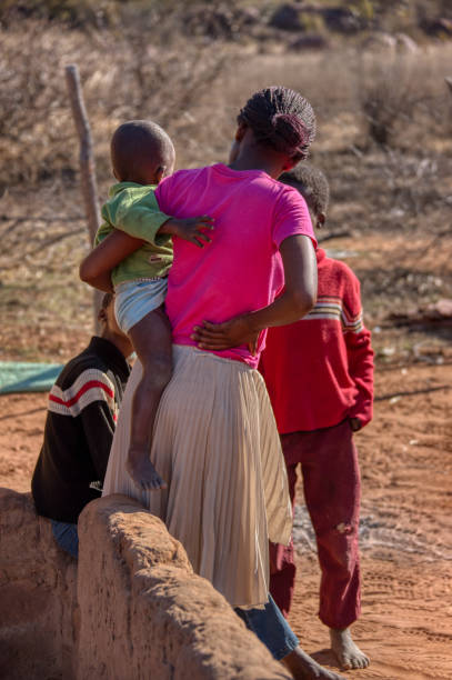 istock mother with kids standing in the yard 1257045026