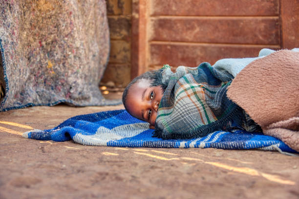istock African sleeping wrapped in blankets child 1257045090