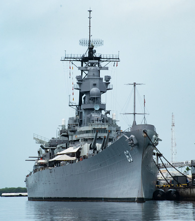 View of the USS Missouri battleship, US Navy designation BB 63. The view is from the water showing the ship docked. Japan surrendered to Allied Forces on the deck of this vessel on September 2, 1945.\nPearl Harbor, Oahu, Hawaii, USA\n04/12/2018