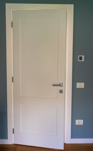 istock White wooden door closed 1257045915