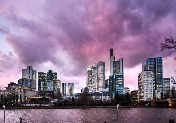 Dramatic purple cloudscape over Frankfurt financial district skyline across the Main river, copy space