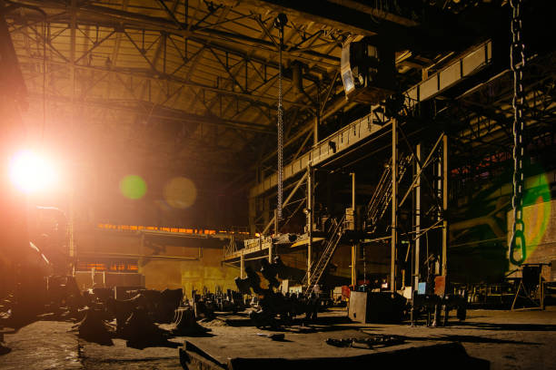 Old broken empty abandoned industrial building interior at night.