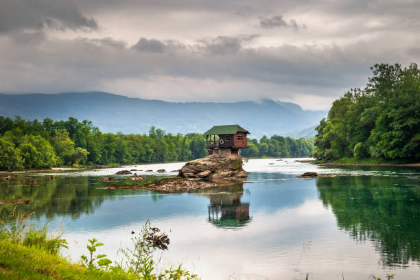 istock Small house on a stone on Drina river 1257047116