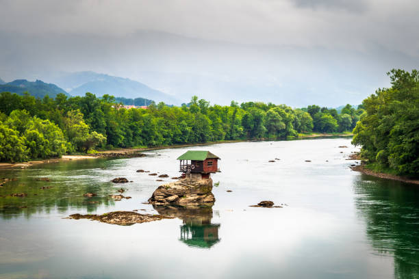 istock Small house on a stone on Drina river 1257047170