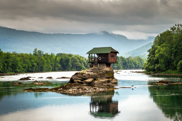 istock Small house on a stone on Drina river 1257047311