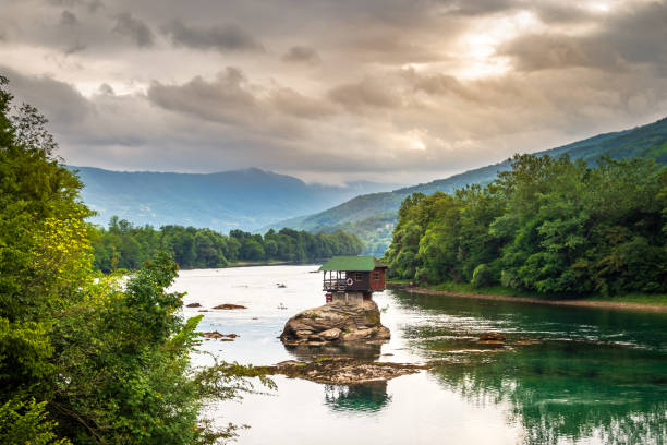 istock Small house on a stone on Drina river 1257047403