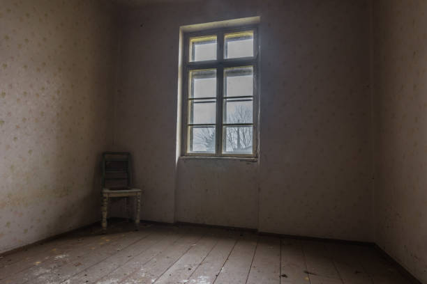 istock dark room with armchair in a corner 1257053800