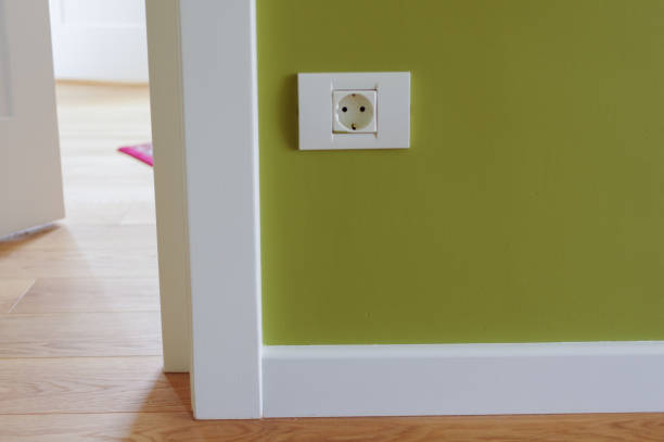 istock White wooden door opened  with Wall Plug 1257053874