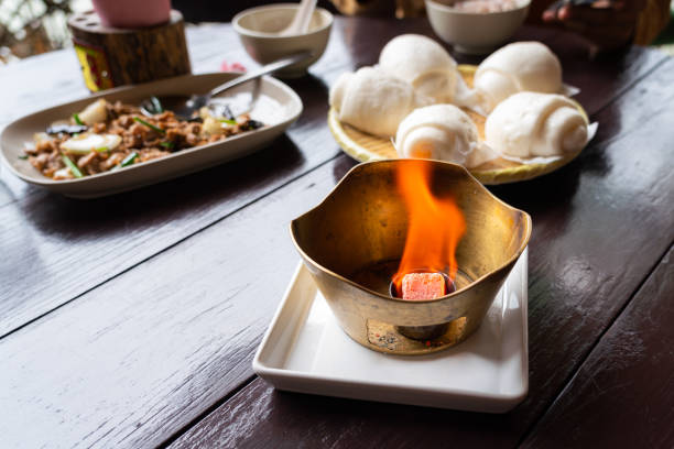 istock A burning coal in the metal pot. 1257056221