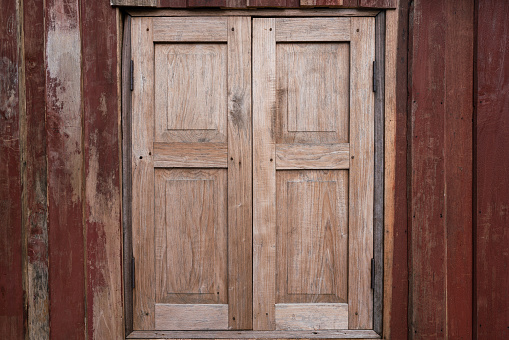 Santa Fe Style: Padlock on Weathered White Wood Garage Doors