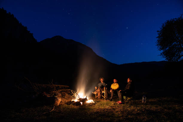 istock Friends Camping Under The Stars In Nature 1257059962