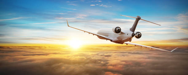istock Private jetplane airplane flying above clouds 1257060011